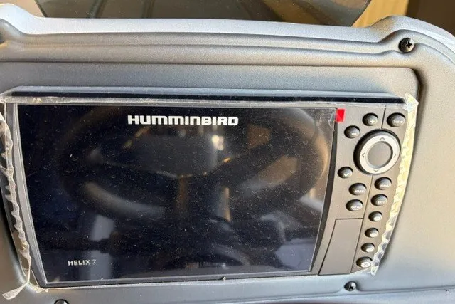Slide: The Image of Humminbird Helix 7 fish finder on 2027 Xpress H20 Crappie boat dashboard. - 13