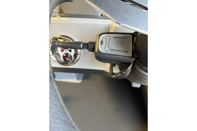 Slide: The Image of 2027 Xpress H20 Crappie boat jack plate control and gauge detail. - 14