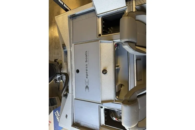 Slide: The Image of 2027 Xpress H20 Crappie boat interior with storage compartments and seating. - 20
