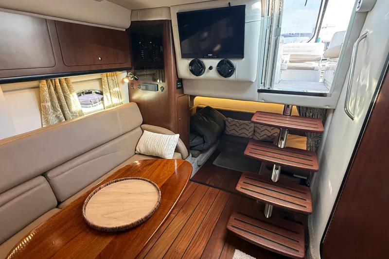 Slide: The Image of Luxurious interior of 2019 Crownline 350 SY yacht with wooden accents and modern amenities. - 27
