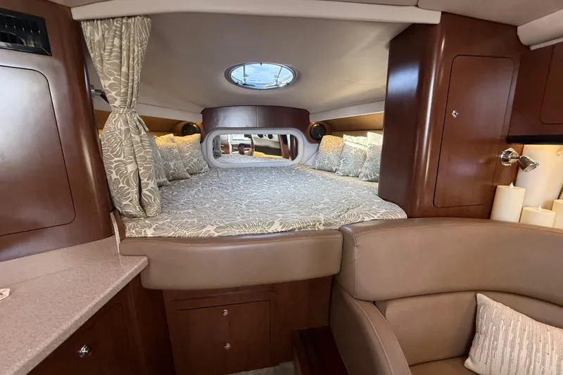 Slide: The Image of Luxurious interior cabin of 2019 Crownline 350 SY yacht with elegant bedding and wood finish. - 22