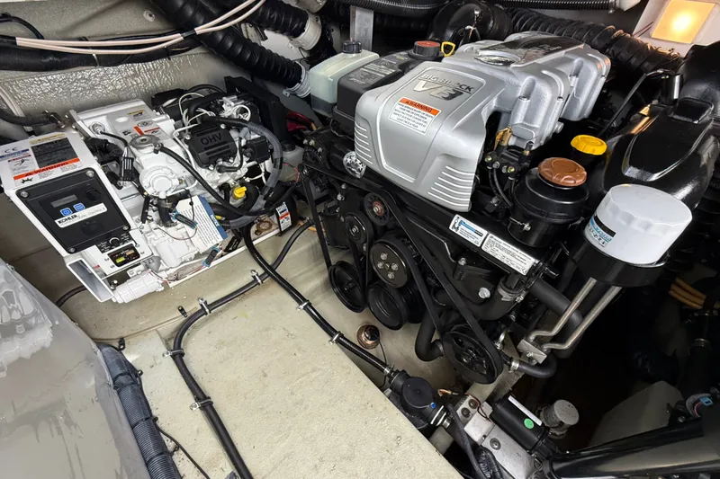Slide: The Image of Engine room of a 2019 Crownline 350 SY boat, showcasing mechanical components and systems. - 30
