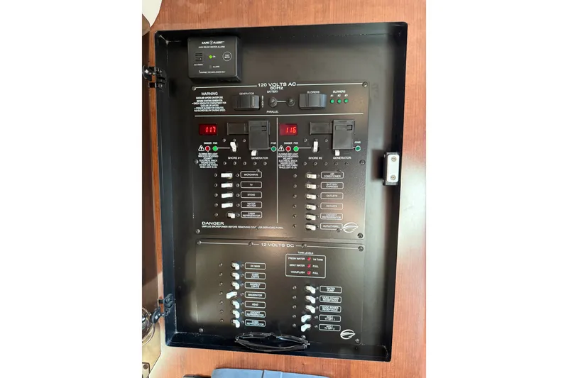 Slide: The Image of Electrical panel of a 2019 Crownline 350 SY boat, featuring various switches and indicators. - 28