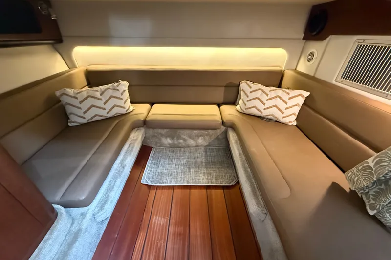 Slide: The Image of Luxurious interior of 2019 Crownline 350 SY yacht with plush seating and elegant decor. - 24