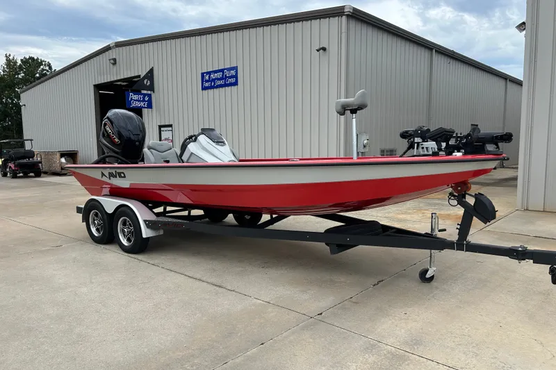 The Image of Red 2022 Avid 20 XB boat on trailer outside service center. - 19