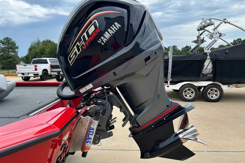 Slide: The Image of 2022 Avid 20 XB boat with Yamaha SHO VMAX outboard motor, parked on a trailer. - 34