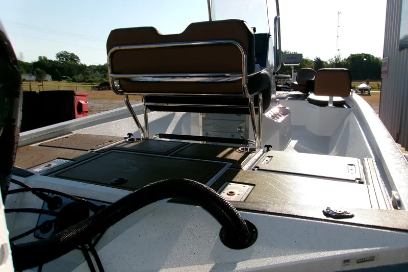 Slide: The Image of 2026 Xpress XR21 Bay boat interior with seating and storage compartments. - 8