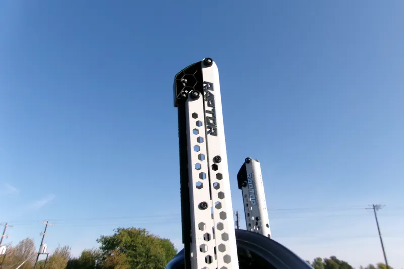 Slide: The Image of Raptor-branded metal poles against clear blue sky, part of Xpress XR21 Bay 2026 model. - 9