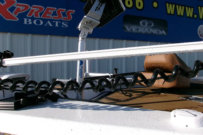 Slide: The Image of 2026 Xpress XR21 Bay boat with trolling motor and branded signage in background. - 20