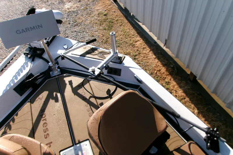 Slide: The Image of 2026 Xpress XR21 Bay boat with Garmin equipment, featuring a detailed deck view. - 10