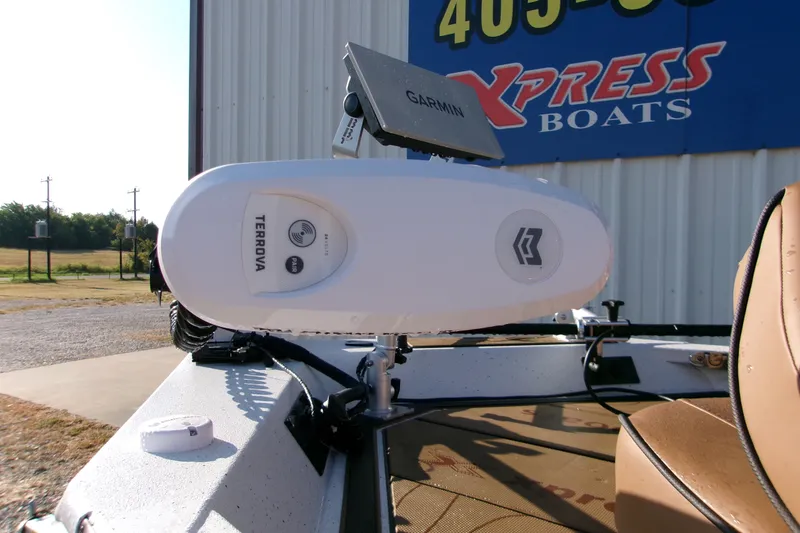 Slide: The Image of 2026 Xpress XR21 Bay boat with Garmin and Terrova equipment, parked outdoors. - 18