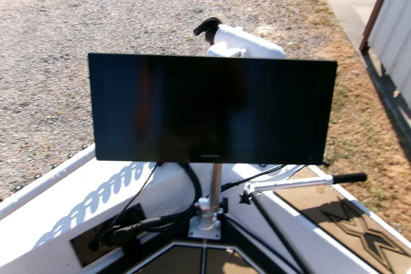Slide: The Image of Xpress XR21 Bay 2026 boat with mounted display screen on deck. - 12