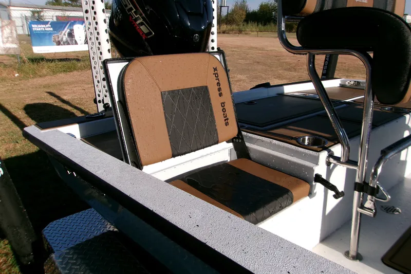 Slide: The Image of 2026 Xpress XR21 Bay boat interior with cushioned seating and sleek design. - 7