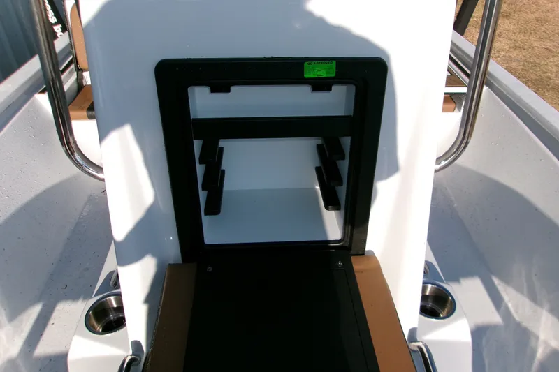 Slide: The Image of 2026 Xpress XR21 Bay boat interior with storage compartment and cup holders. - 15