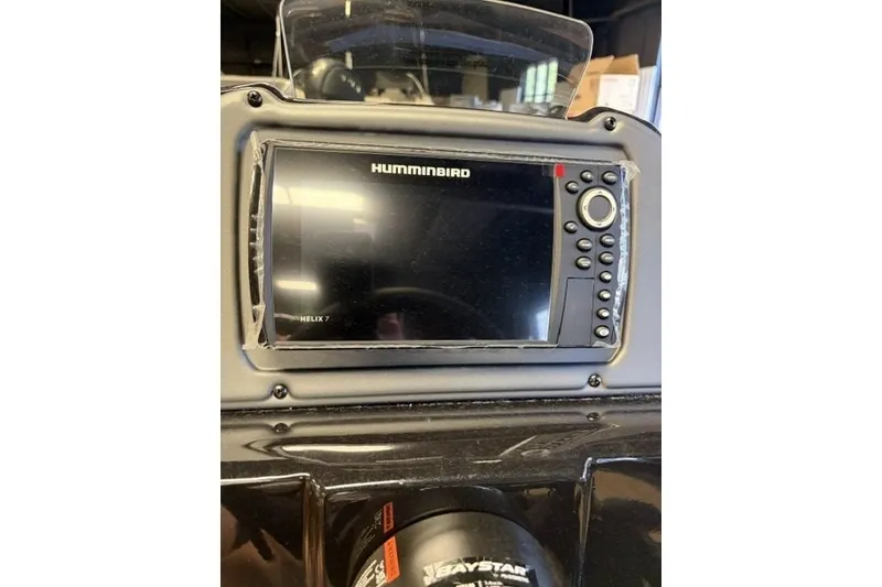 Slide: The Image of Humminbird Helix 7 fishfinder on 2027 Xpress H18 Bass boat dashboard. - 17