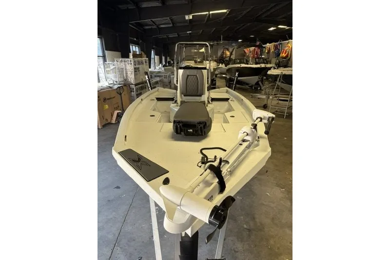 Slide: The Image of 2027 Xpress H20 Bay boat in showroom, featuring sleek design and advanced equipment. - 3