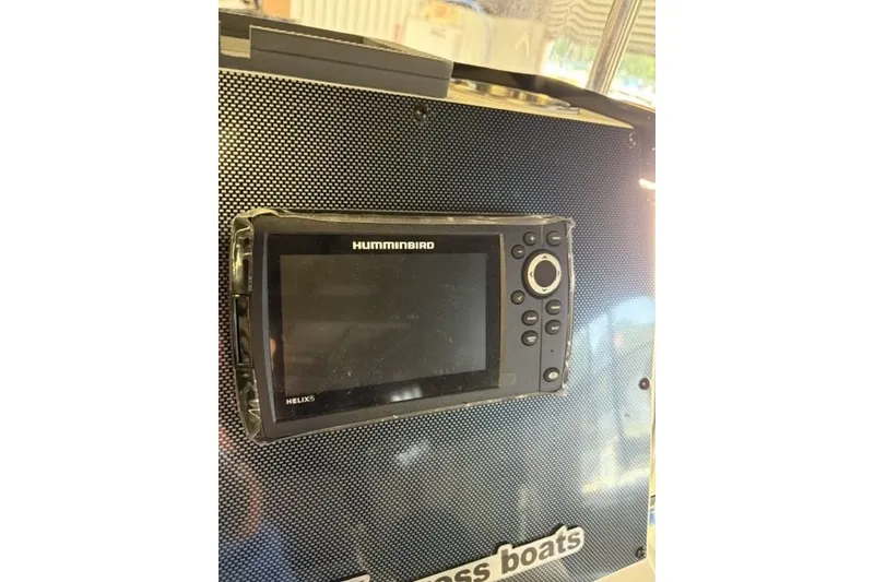 Slide: The Image of Humminbird Helix 5 fish finder on 2027 Xpress H20 Bay boat dashboard. - 17
