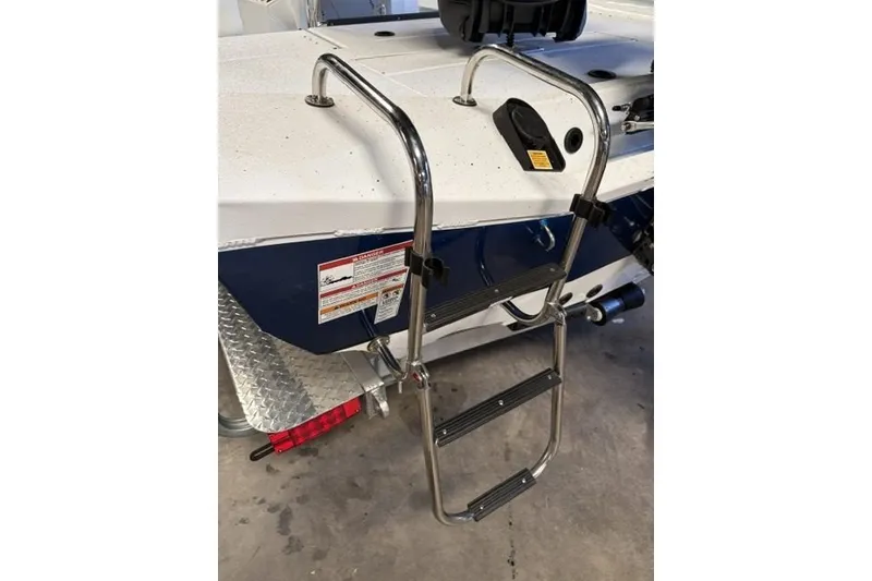 Slide: The Image of Stainless steel ladder on 2027 Xpress H20 Bay boat, docked indoors. - 6