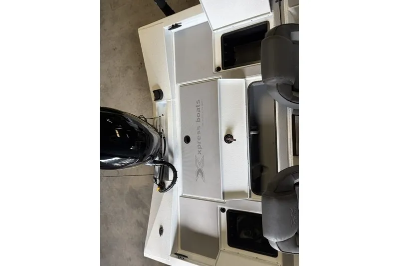Slide: The Image of 2027 Xpress H18 Bass boat interior with storage compartments and seating. - 15