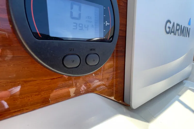 Slide: The Image of Dashboard of a 2022 Rossiter 20 boat featuring Garmin electronics. - 42