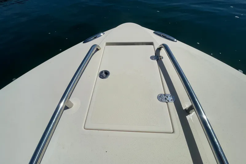 Slide: The Image of Bow of 2022 Rossiter 20 boat with stainless steel rails on calm water. - 55