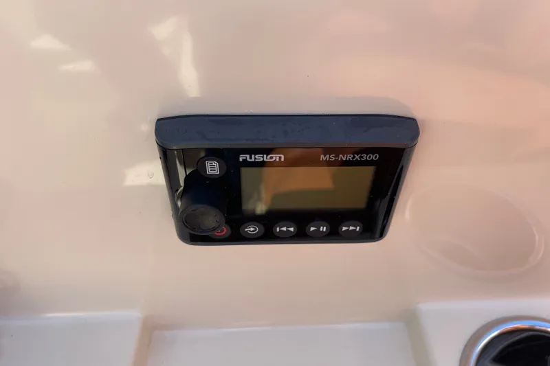 Slide: The Image of Fusion MS-NRX300 marine stereo on 2022 Rossiter 20 boat dashboard. - 48