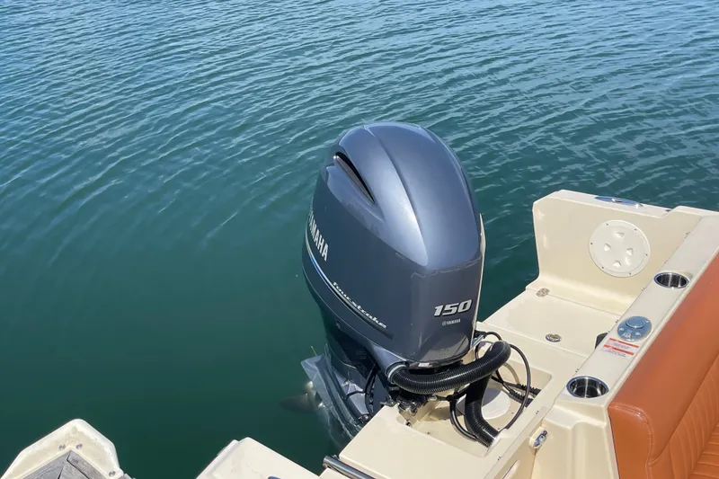 Slide: The Image of 2022 Rossiter 20 boat with Yamaha 150 outboard motor on calm water. - 21