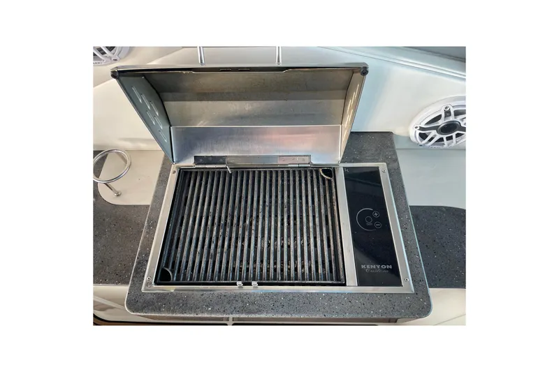 Slide: The Image of Built-in grill on 2012 Sea Ray 330 Sundancer boat, featuring Kenyon Custom design. - 14
