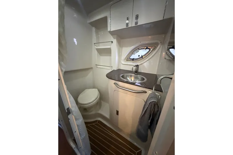 Slide: The Image of Bathroom interior of 2012 Sea Ray Sundancer 330 yacht with sink and toilet. - 26