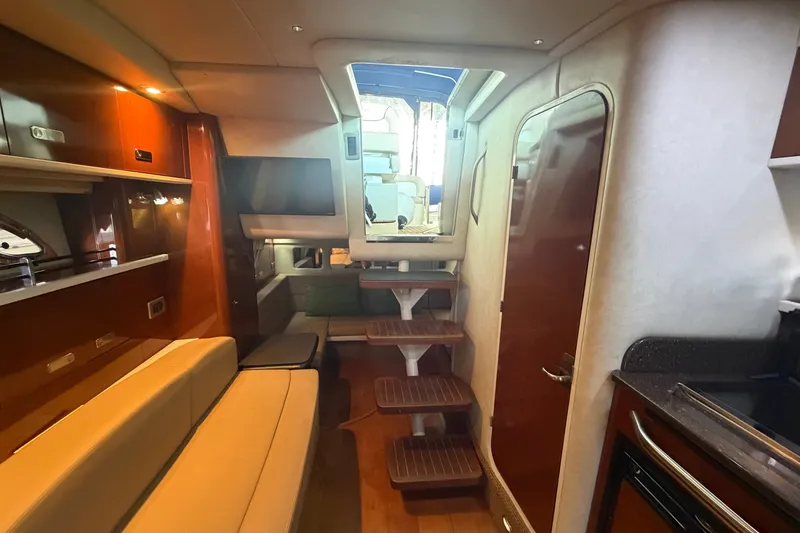 Slide: The Image of Interior of a 2012 Sea Ray Sundancer 330 yacht with elegant wood finishes. - 29