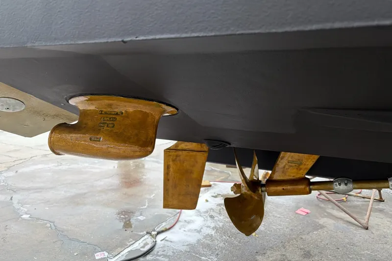 Slide: The Image of Close-up of 2012 Sea Ray Sundancer 330 propeller and rudder system. - 33