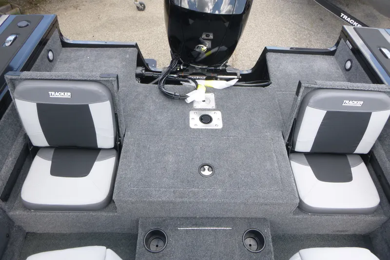Slide: The Image of 2027 Tracker Targa V-19 Combo boat interior with gray seating and motor. - 14