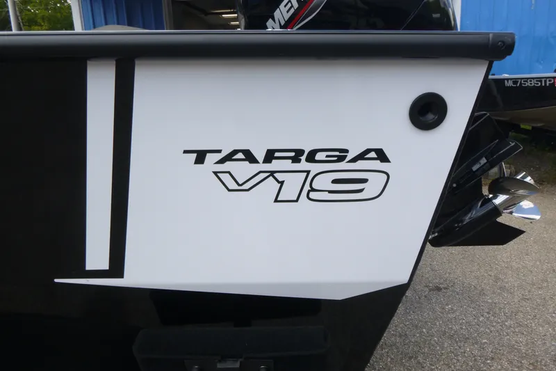 Slide: The Image of 2027 Tracker Targa V-19 Combo boat, close-up of model name on hull. - 18