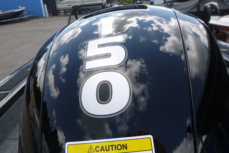 Slide: The Image of Close-up of a Tracker Targa V-19 Combo 2027 boat engine with "150" label. - 17