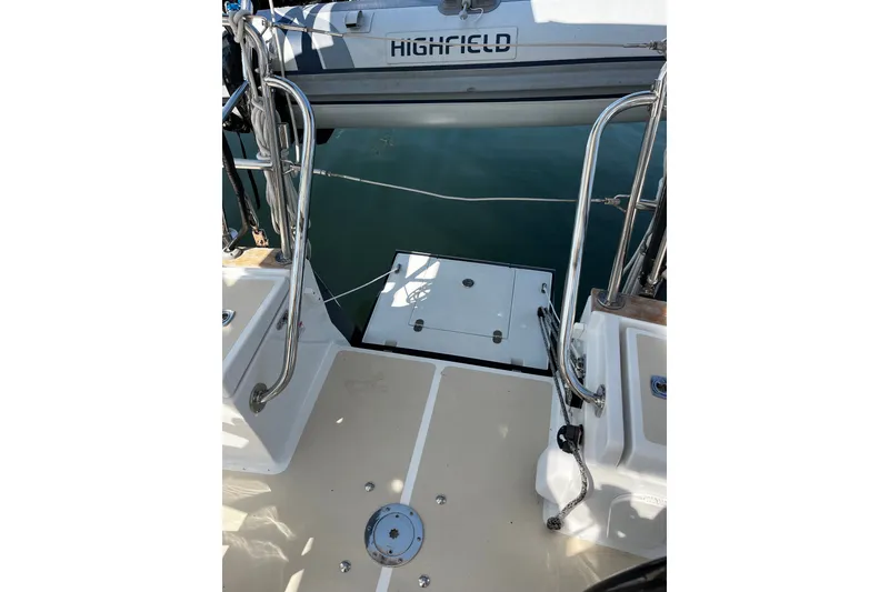 Slide: The Image of 2024 Tartan 395 yacht deck with stainless steel railings and a Highfield dinghy. - 53
