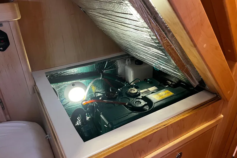Slide: The Image of Engine compartment of 2024 Tartan 395 yacht, featuring insulation and lighting. - 22