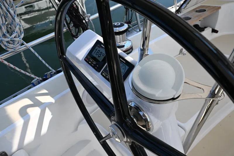 Slide: The Image of 2024 Tartan 395 yacht helm with navigation instruments and steering wheel. - 41