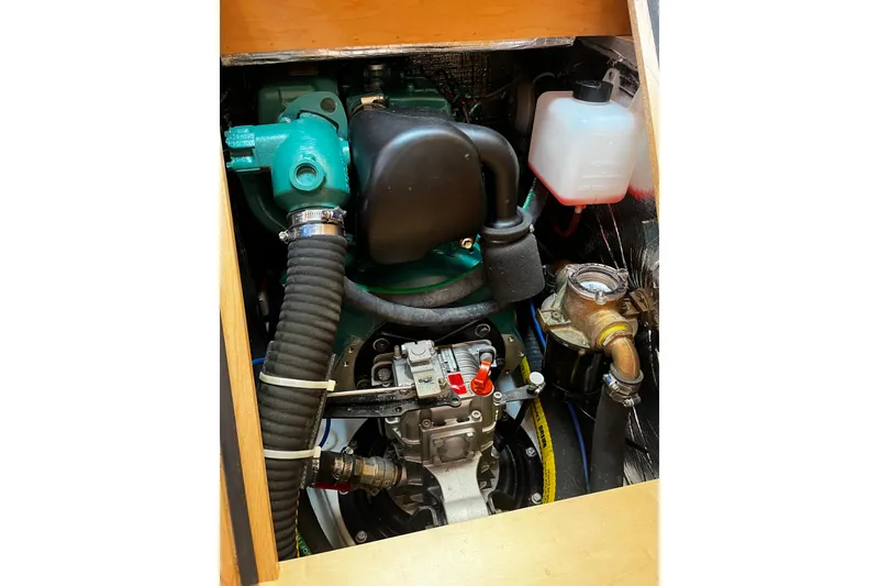 Slide: The Image of Engine compartment of 2024 Tartan 395 sailboat, showcasing mechanical components and hoses. - 20