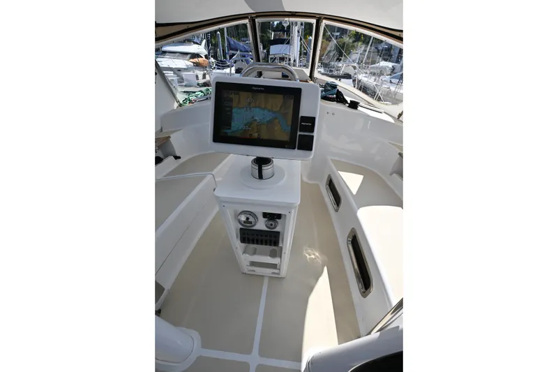 Slide: The Image of 2024 Tartan 395 yacht cockpit with navigation display and seating area. - 42