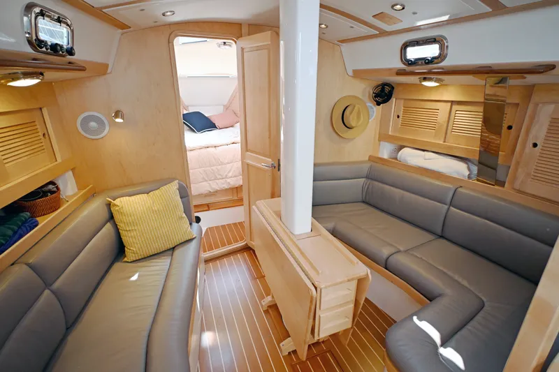 Slide: The Image of Luxurious interior of 2024 Tartan 395 yacht with cozy seating and elegant wood finishes. - 3