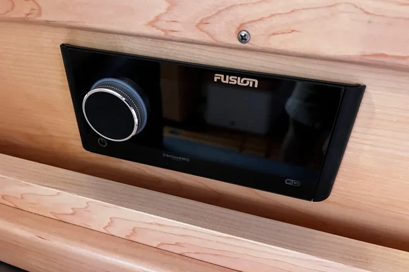 Slide: The Image of Fusion audio system in 2024 Tartan 395 yacht, mounted on wooden panel. - 18