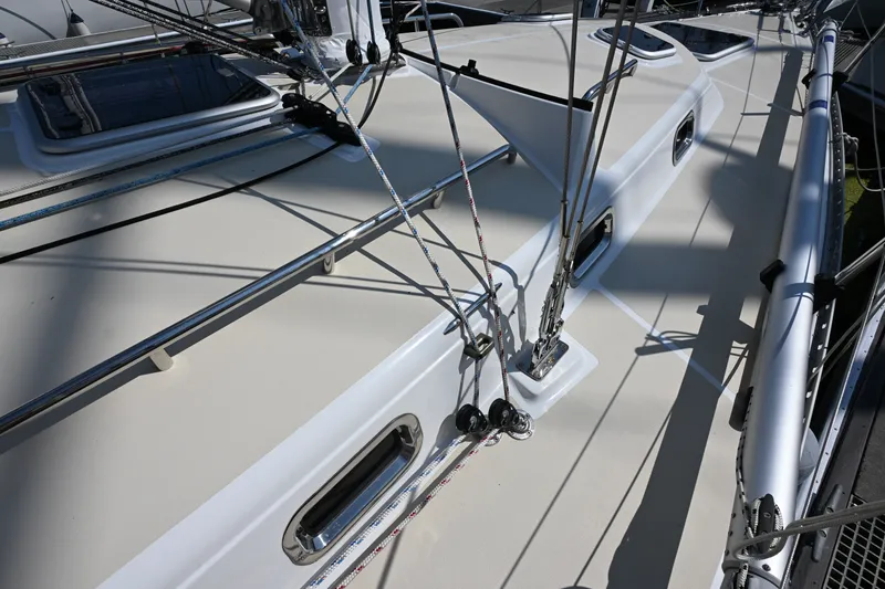 Slide: The Image of 2024 Tartan 395 yacht deck with rigging and hatches in sunlight. - 27