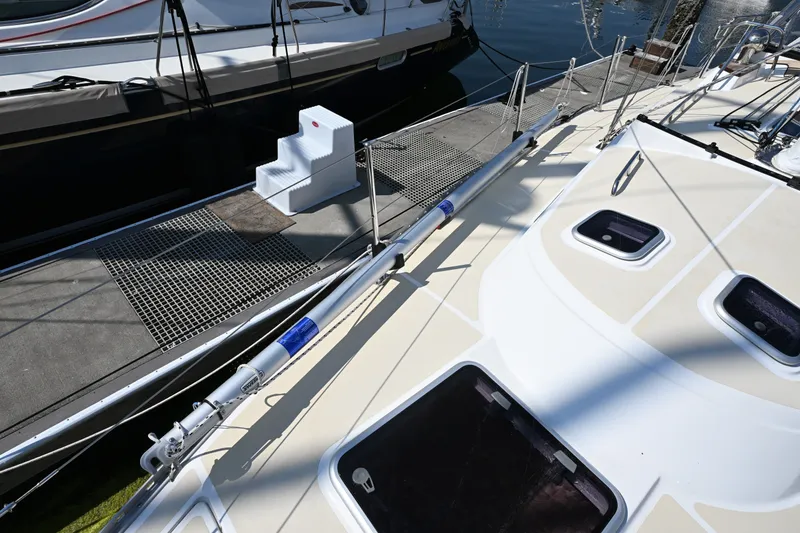 Slide: The Image of 2024 Tartan 395 yacht docked, showcasing sleek deck design and modern features. - 34