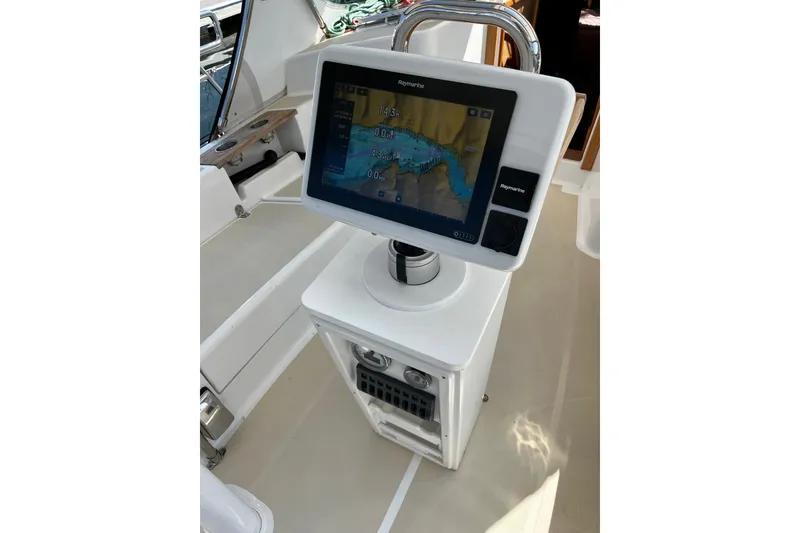 Slide: The Image of 2024 Tartan 395 yacht navigation system with Raymarine display in cockpit. - 49