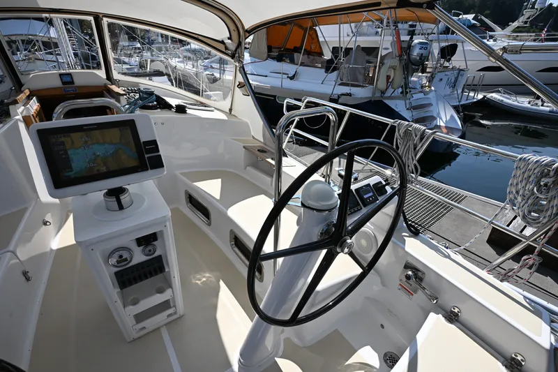 Slide: The Image of Cockpit of 2024 Tartan 395 sailboat with navigation equipment and steering wheel at marina. - 40