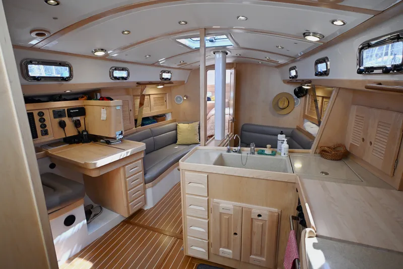 Slide: The Image of Luxurious interior of 2024 Tartan 395 yacht with modern amenities and elegant wood finishes. - 1