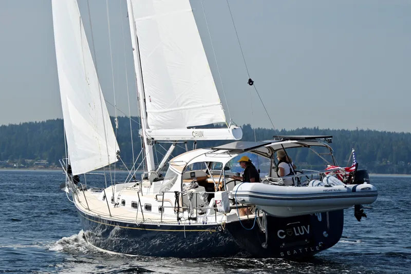 Slide: The Image of Sailing yacht Tartan 395, 2024 model, cruising on open water with crew onboard. - 61