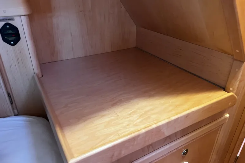 Slide: The Image of Wooden interior shelf in 2024 Tartan 395 yacht cabin. - 21
