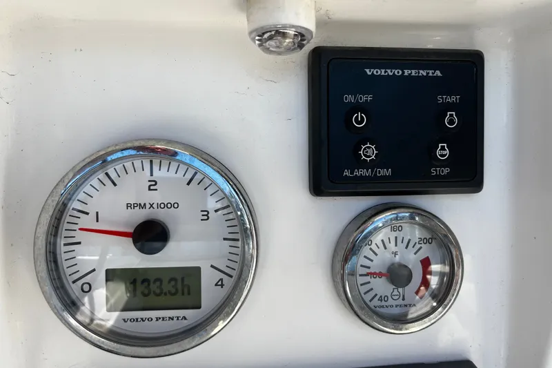 Slide: The Image of Volvo Penta control panel with RPM and temperature gauges on Tartan 395, 2024 model. - 58