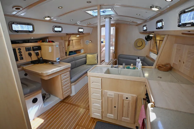 Slide: The Image of Luxurious interior of 2024 Tartan 395 yacht featuring modern kitchen and seating area. - 8